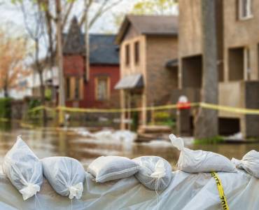 Sandbags in front of a row of houses