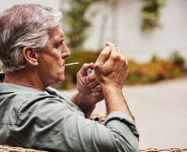Man smoking outdoors