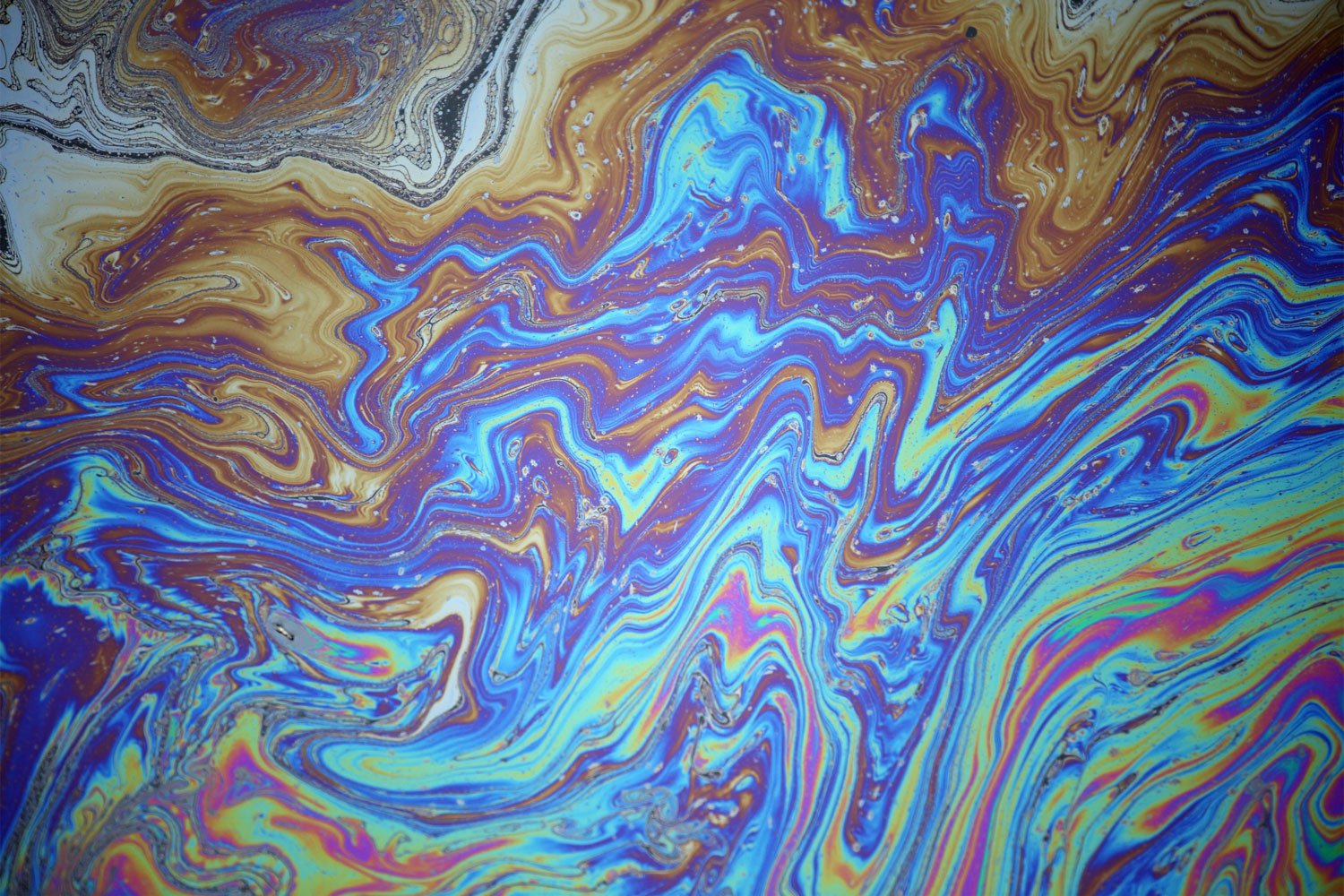 Oil spill on top of water