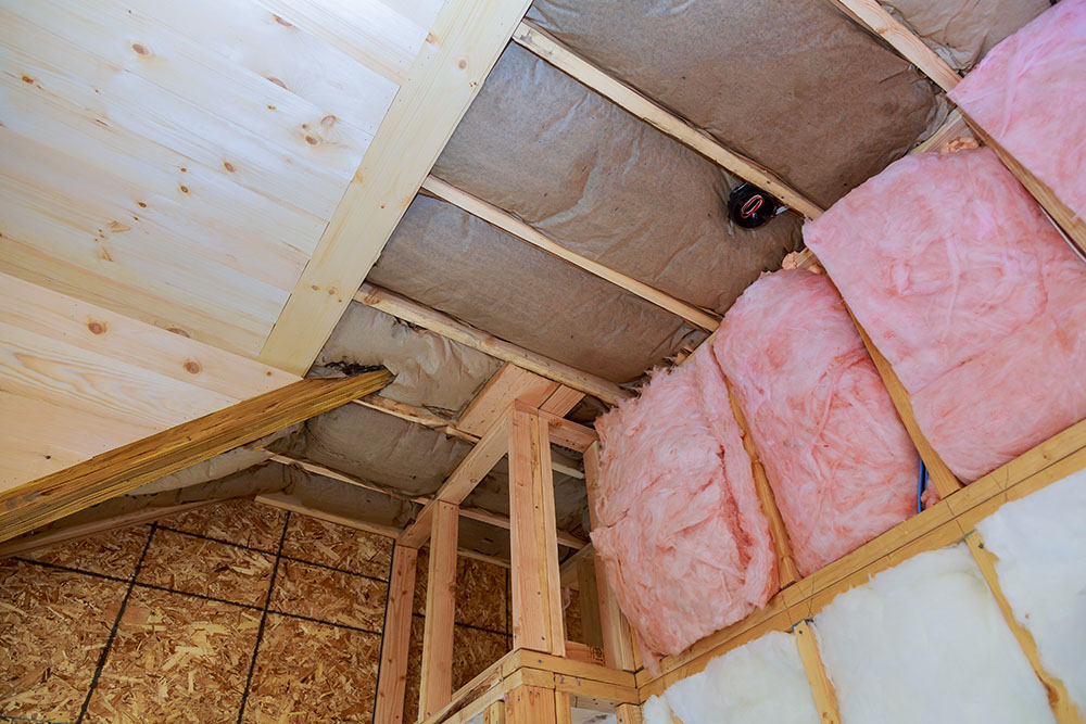 The inside of an attic with new insulation