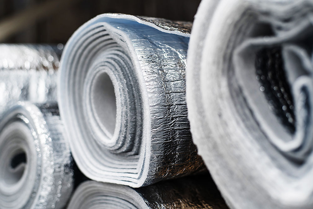 Rolls of insulation with foil