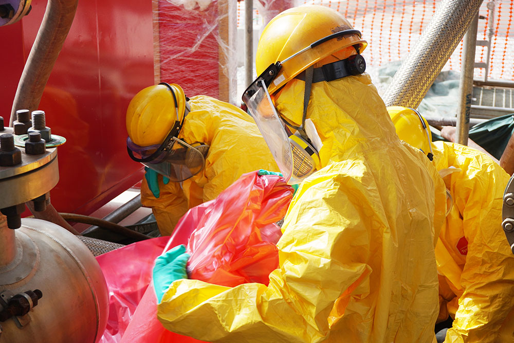 A group of workers containing a chemical spill