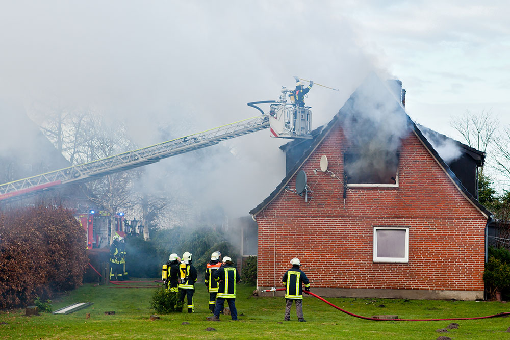 Firemen putting out a house fire