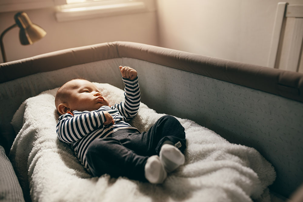 Baby asleep in a crib