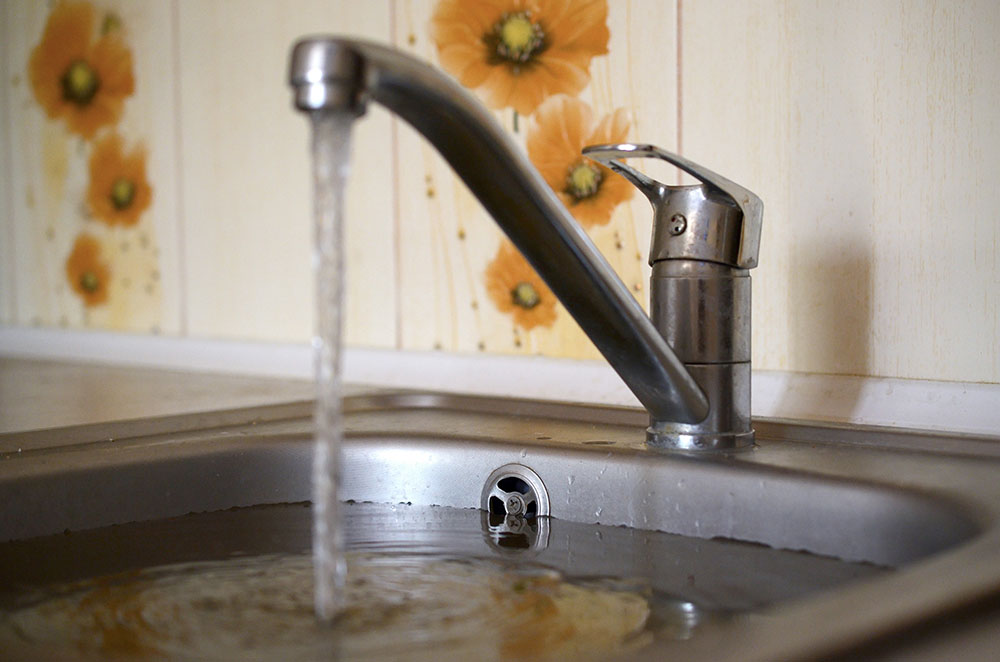 Blocked sink filled with water