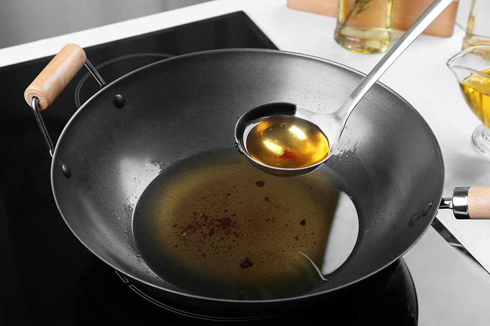 Cooking oil in a wok pan