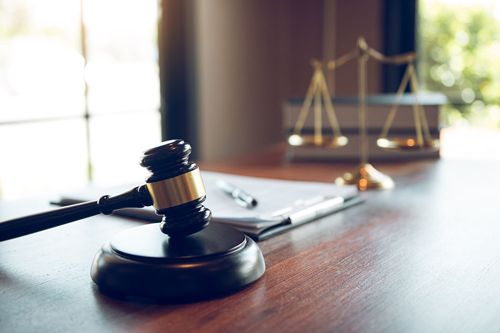 A close-up of a gavel in a courtroom