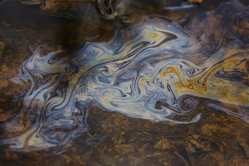 Oil spill on pond water