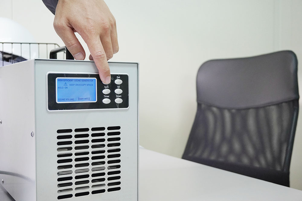 Person turning on an ozone generator