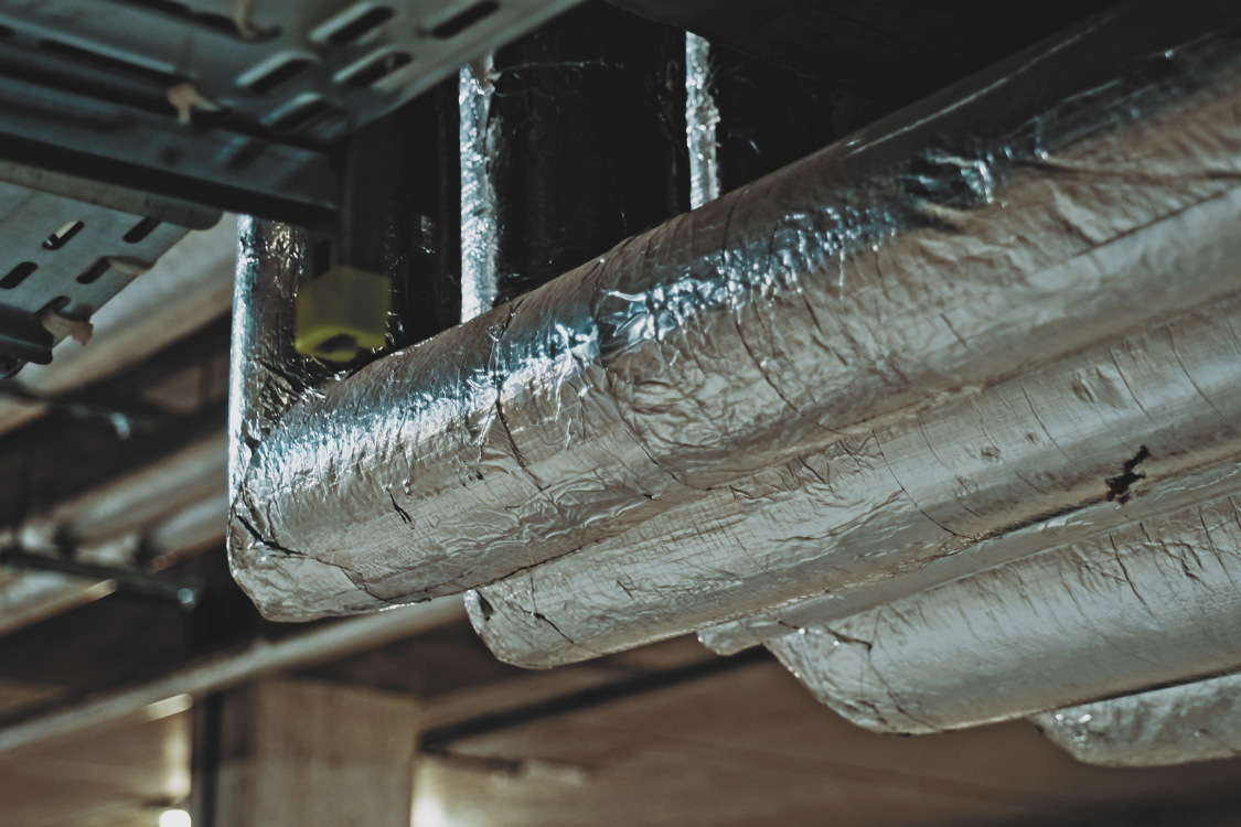 Pipes covered in aluminium thermal insulation