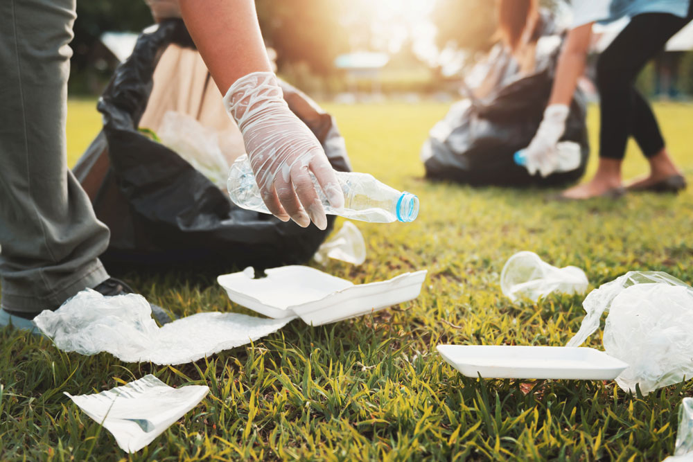 Event cleaners picking up litter