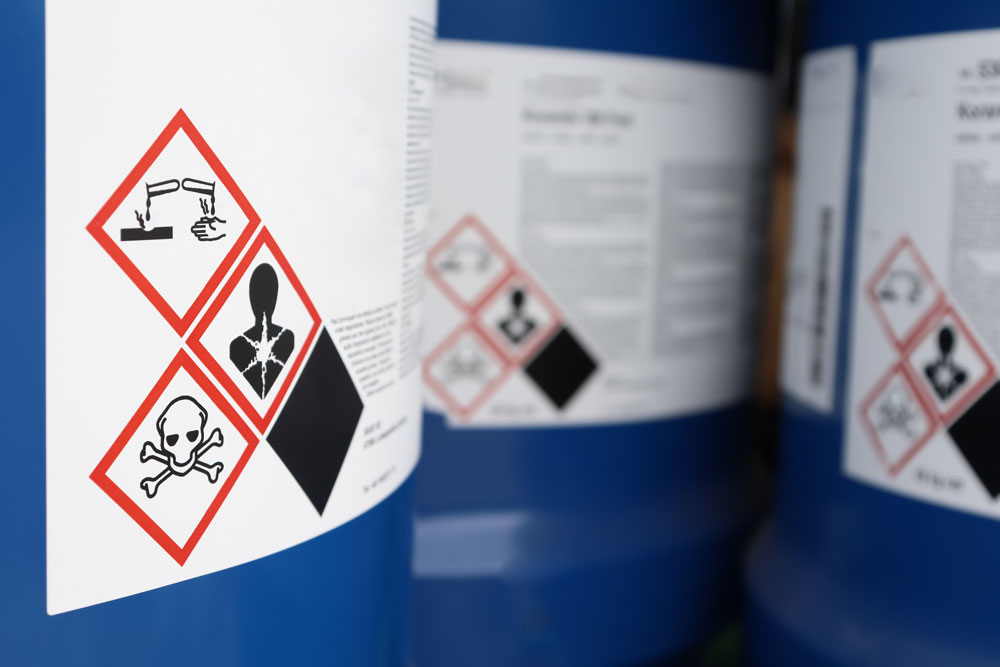 Corrosive symbol on chemical bottle