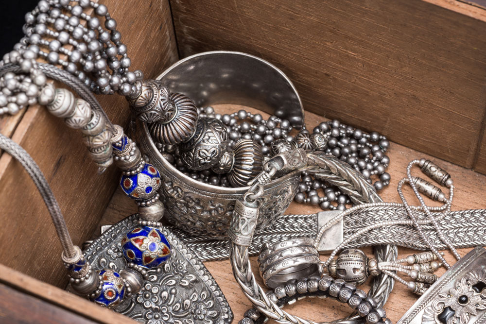 Silver jewellery in a wooden box