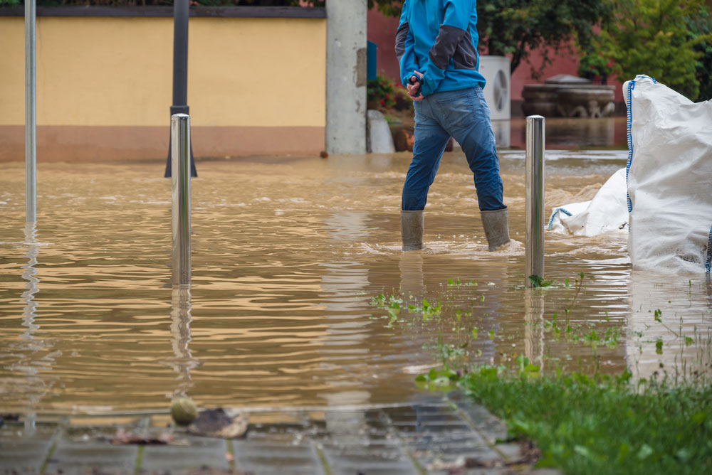 Someone walking through a flooded street