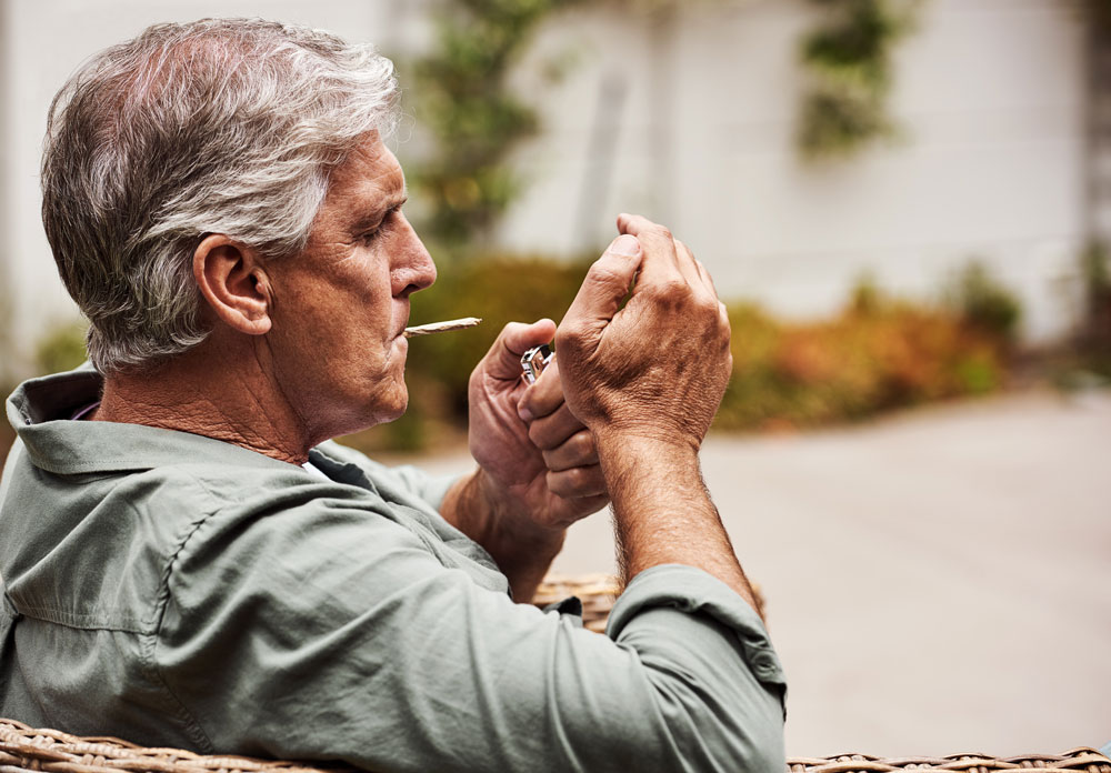 A man smoking outdoors