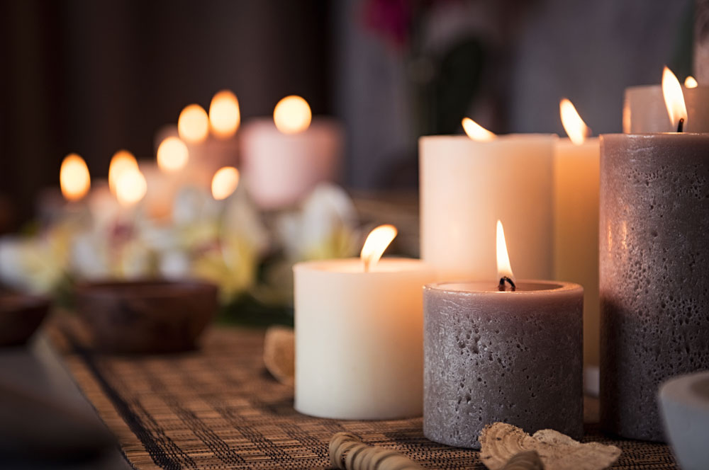 Candles burning on a wooden table