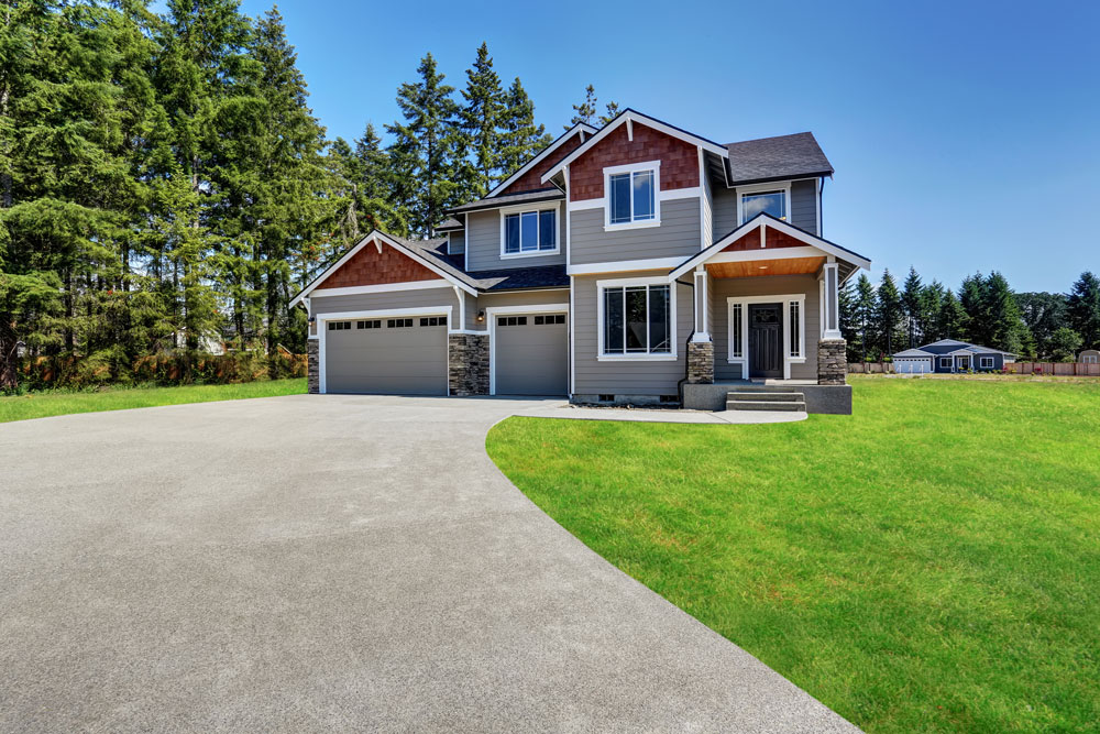 Concrete driveway outside of a house