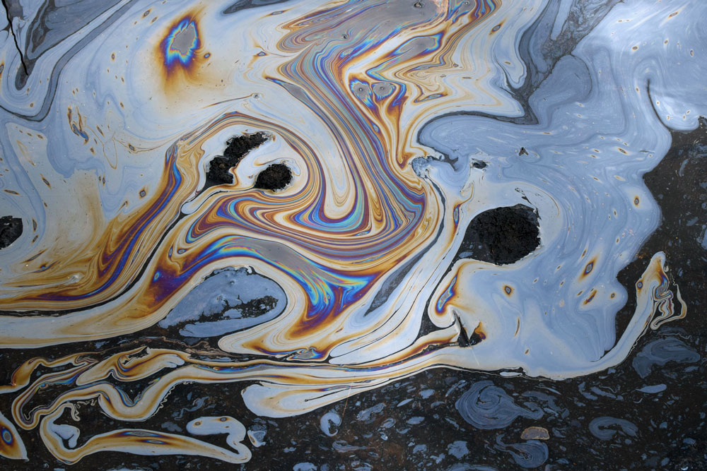 A close-up of a puddle of oil