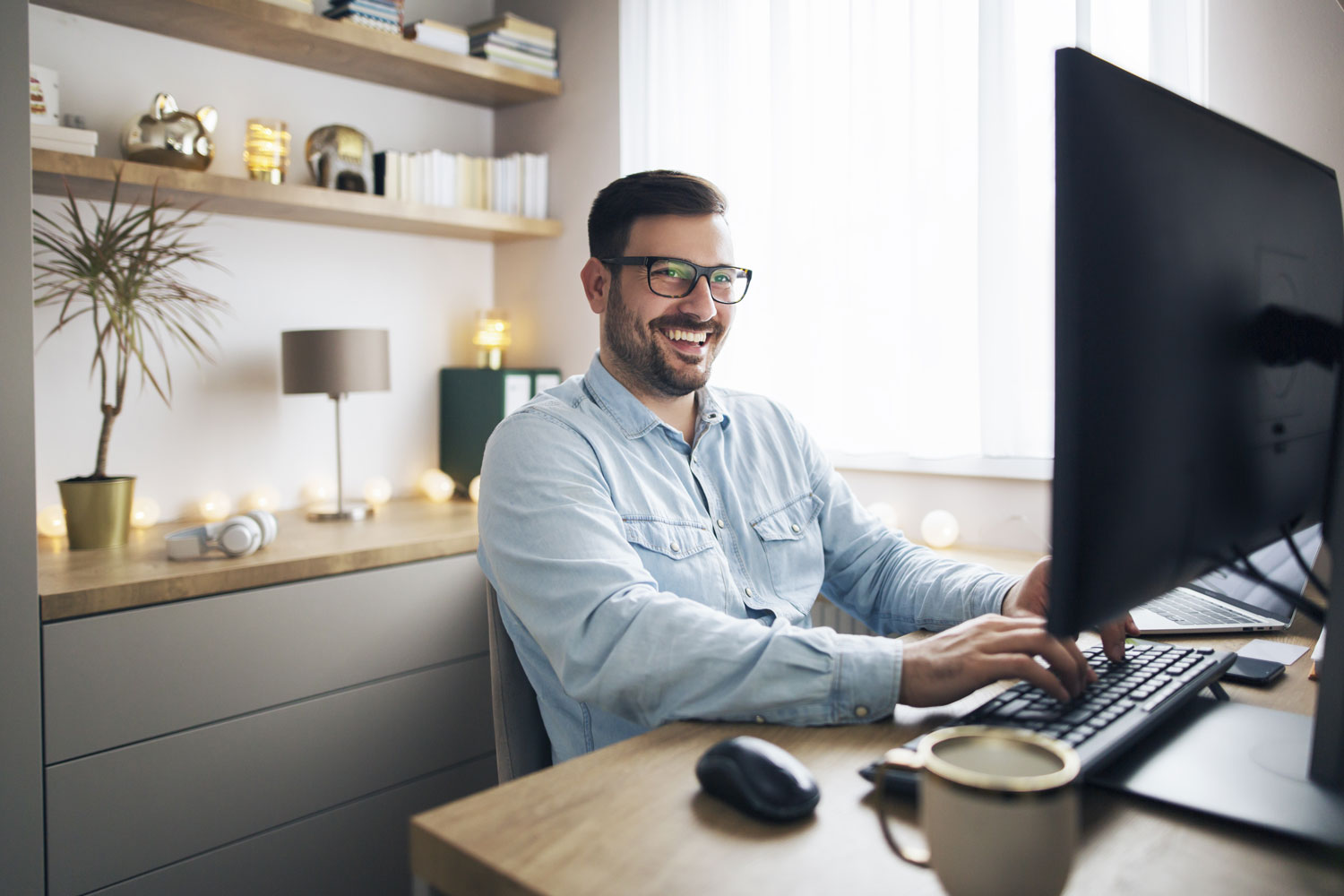 Man happily working from home office