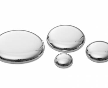Mercury beads on a white surface