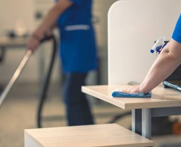Contract cleaners cleaning an office