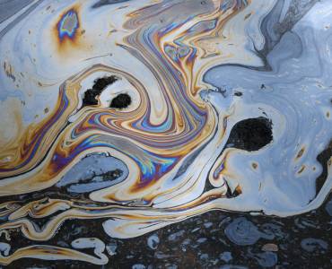 A close-up of a puddle of oil
